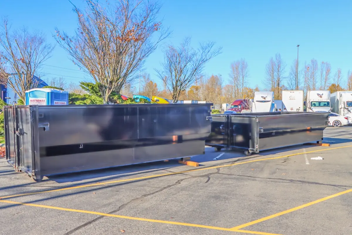 Professional dumpster rental service with roll-off container on residential driveway in Egypt Lake-Leto